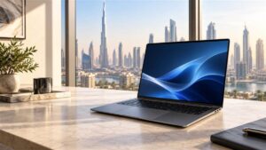 Editorial image of a graphite laptop on a desk in a Dubai office for the Samsung Galaxy Book6 review